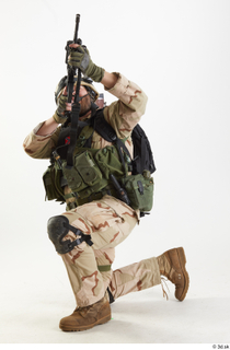  Photos Robert Watson Operator US Navy Seals aiming gun kneeling whole body 0002.jpg